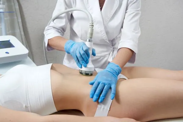 Lost the Weight but Not the Loose Skin? 2 woman having HIFU treatment on her stomach to combat loose skin Winslow following weight loss